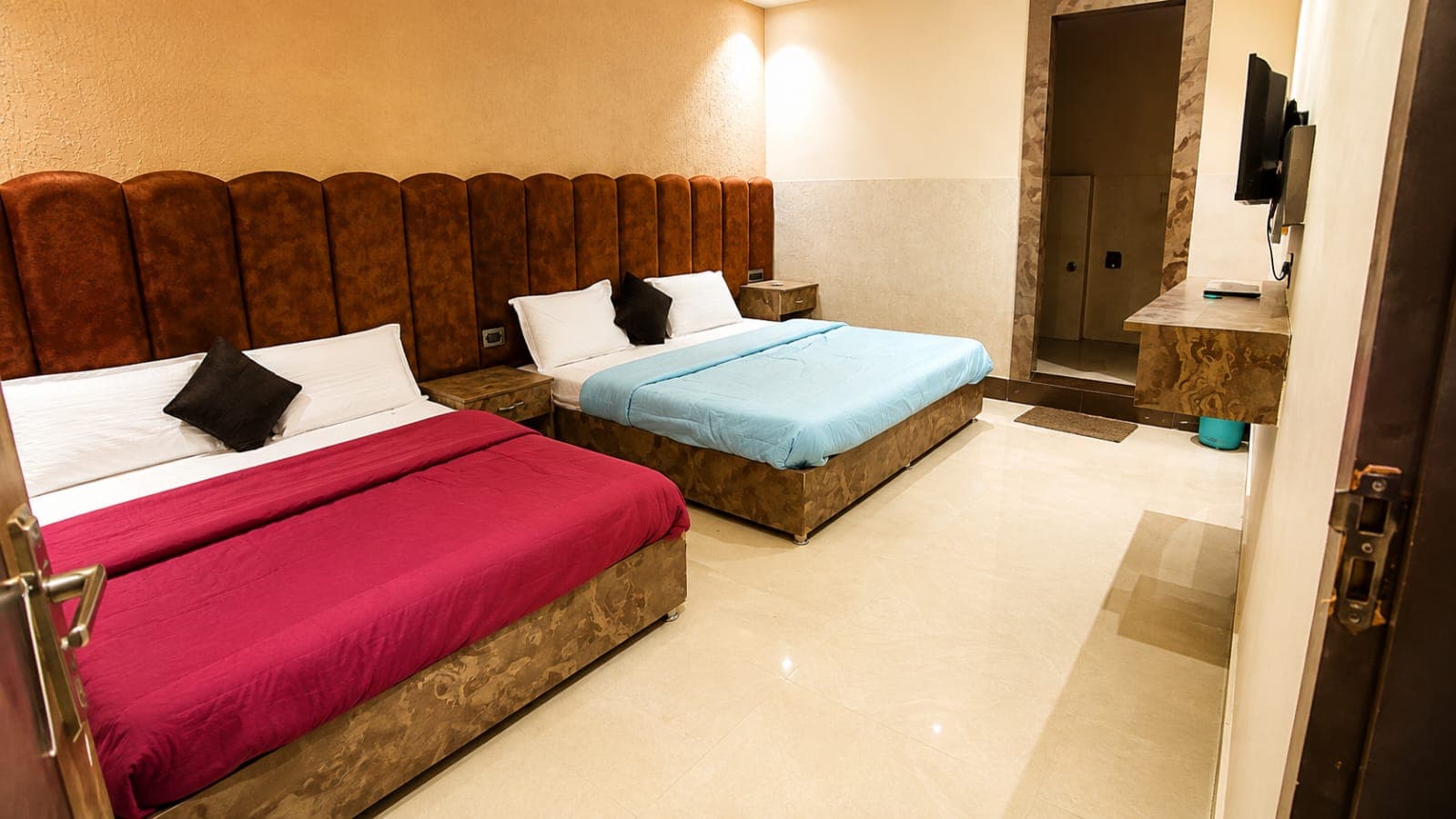 Room with two large beds at Durga Palace